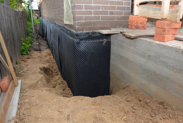 SJ Waterproofing Pros technician performing targeted Exterior Waterproofing assessment in Topeka, IN